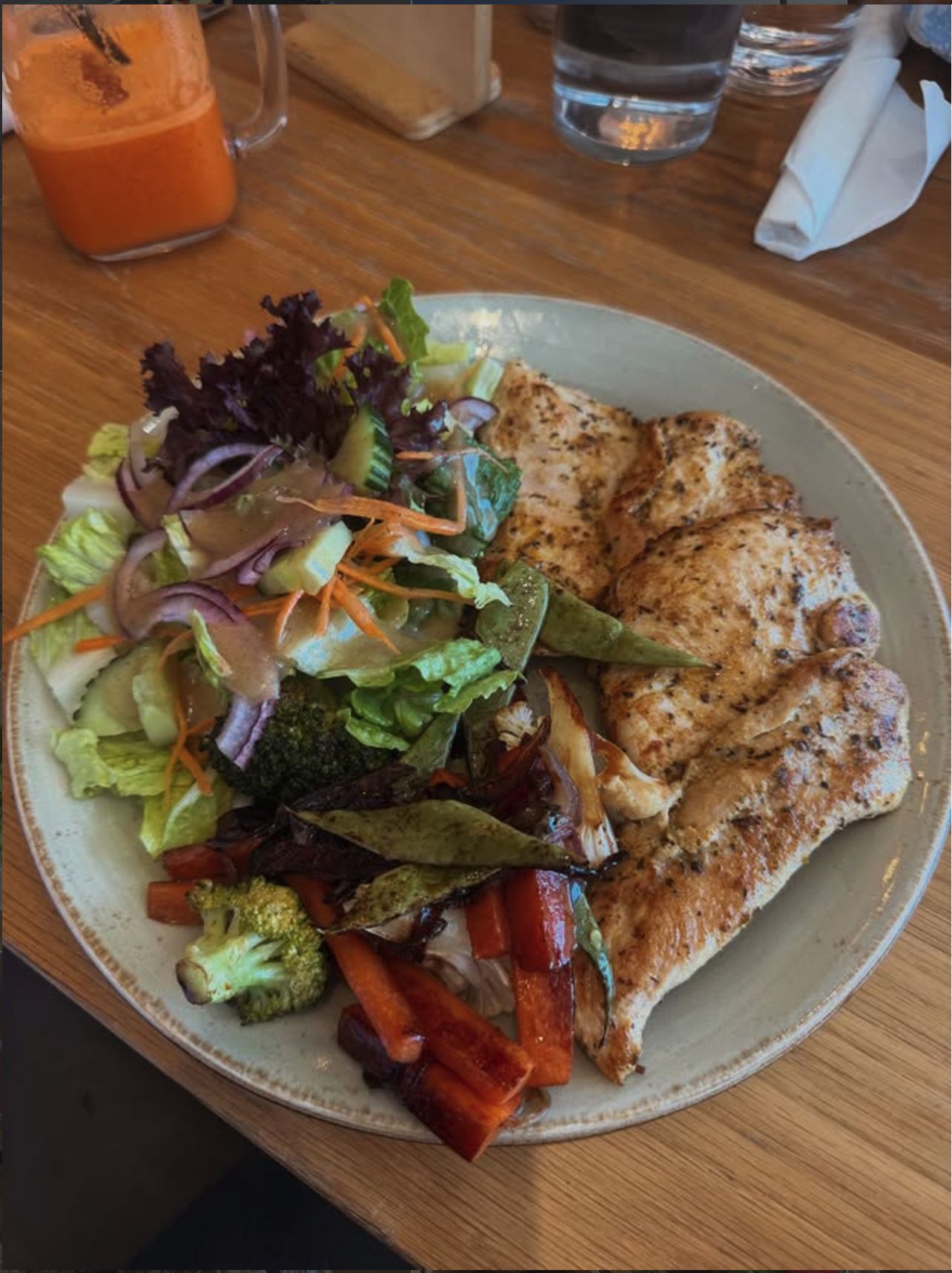 Grilled chicken breast with salad and roast vegetables