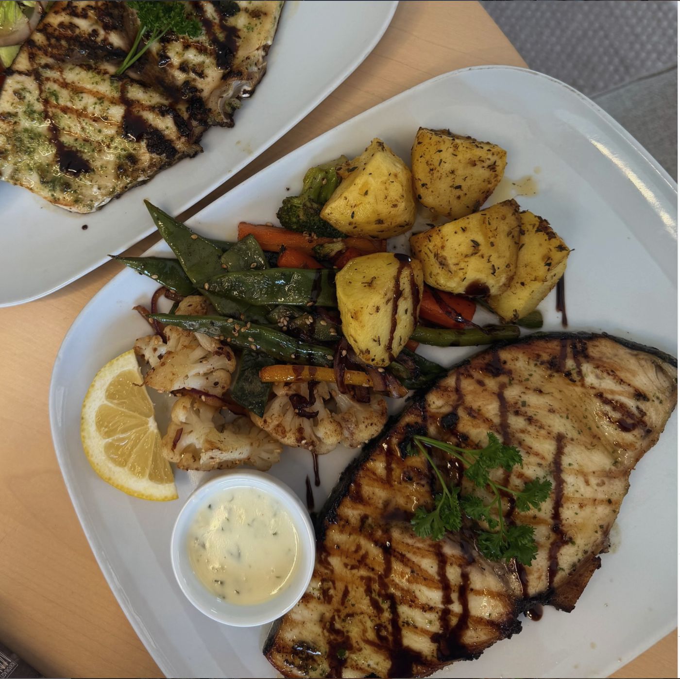 The special of the day: grilled fish with potatoes and vegetables